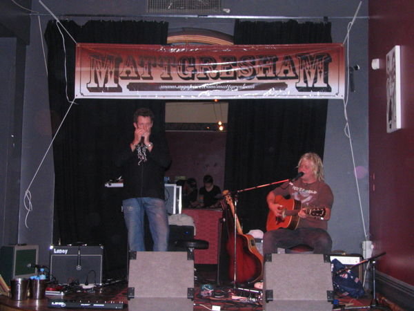 Matt Gresham (on guitar) with a harmonica-playing friend