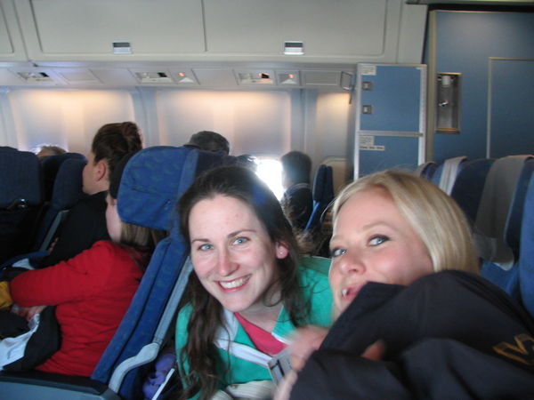 Kristie and Danae party at the back of the plane