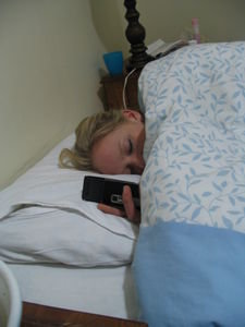 Danae falls asleep with her phone