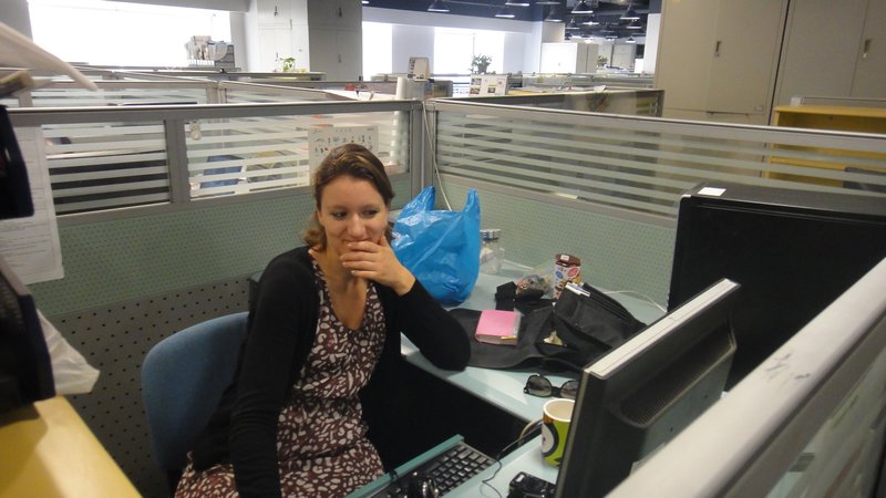 Dafne ponders in her cubicle