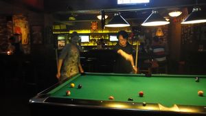 Dafne gets a lesson in pool