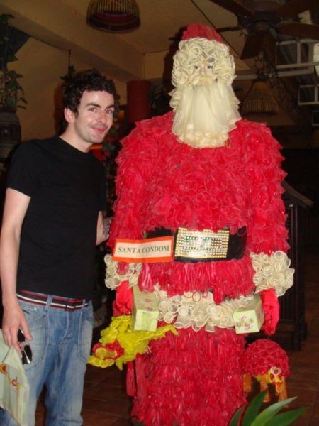 Neil with a giant Santa made of condoms