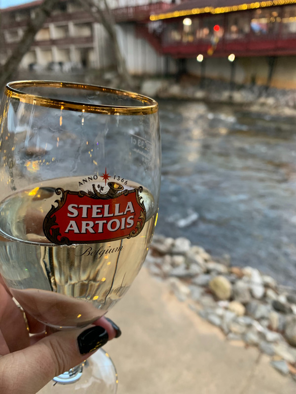 Wine in a beer class by the River. 