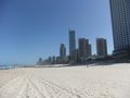 Surfer beach and highrises