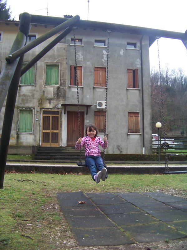 Swinging in front of our old house