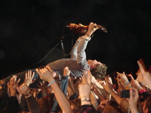 Playing the guitar whilst crowd-surfing