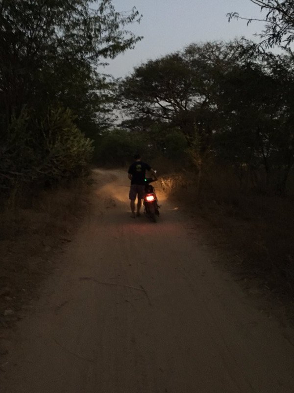 Walking into darkness with a broken bike