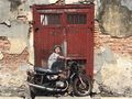 Street art - kid on a motorbike