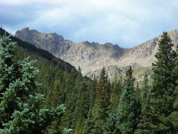 An unnamed craggy mountain to the left of Pettingell Peak along the Divide