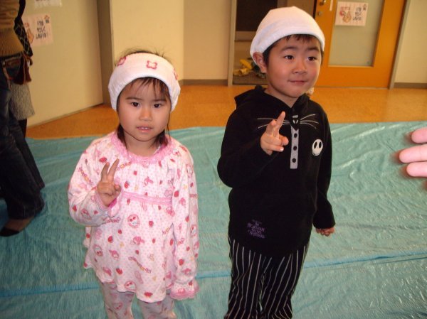 Satsuki and Tetsushi in their P.J's ready to sing "Wash your face in orange juice"