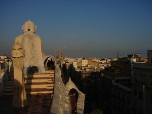 Barcelona 2 (038) Casa Mila roof, Chimneys with Sagrada Familia in the back