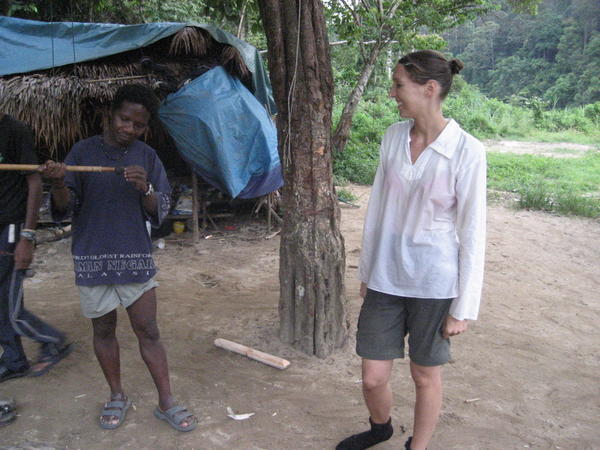 Jenny inspecting a tribesman's blowpipe