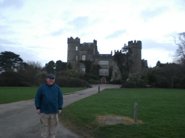 Hughie in front of his house