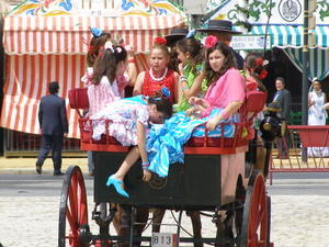Girls catch a ride in their finery