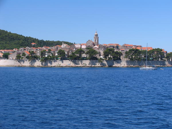 The walled Korcula rises from the sea