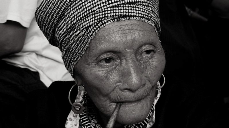The woman smoking pipe