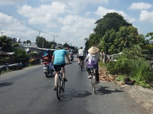 Passing elderly Vietnamese Cyclist