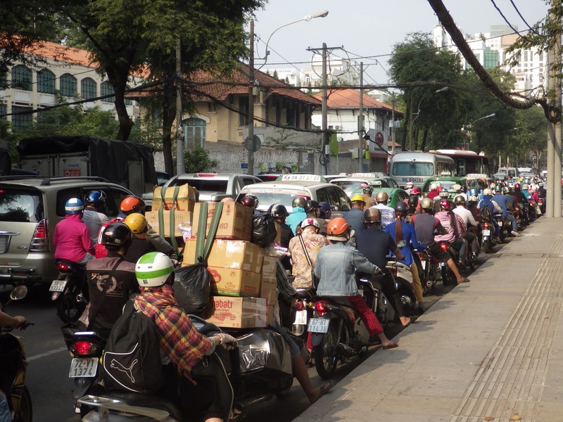 Boxes Piled High on Scooter in Saigon Scooter Traffic