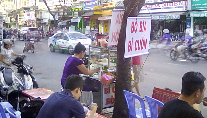 Constant food stalls in rapid Saigon