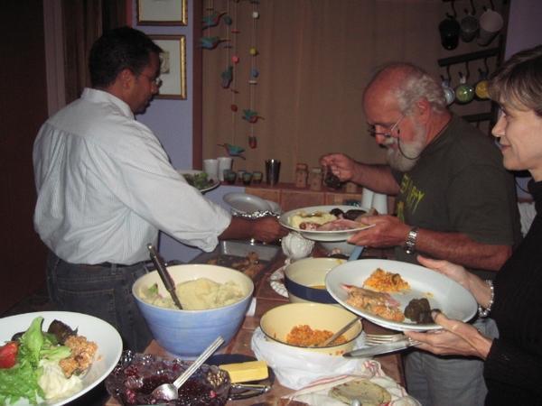 Guests and friends enjoying Thanksgiving buffet