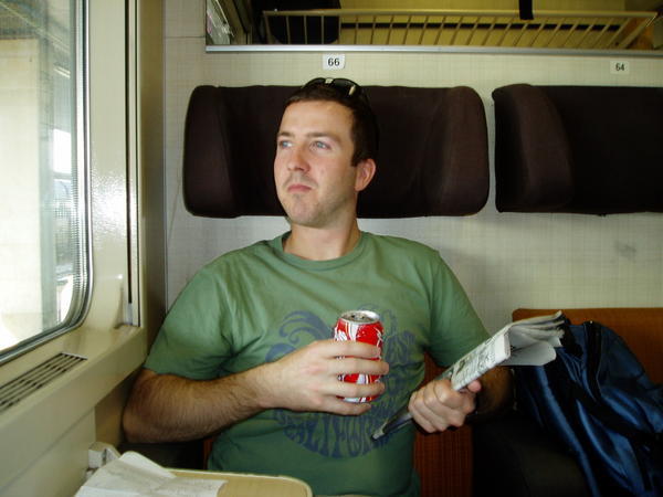 Relaxing with a refreshing beverage on the train