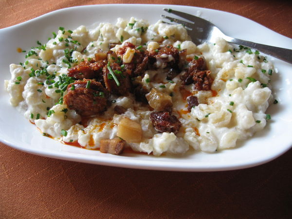 Traditional Slovak meal with potato dumplings and sausage