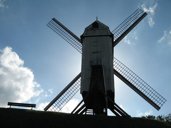 Windmill and park bench on a hill