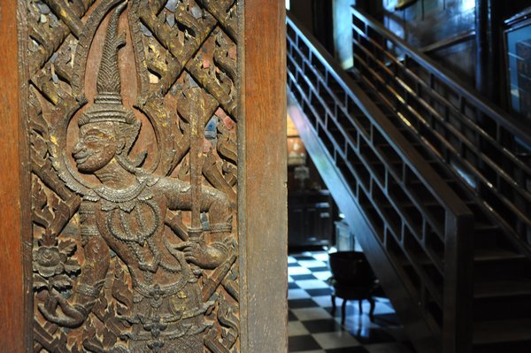 Detailed wood carvings and sculptures decorate the house