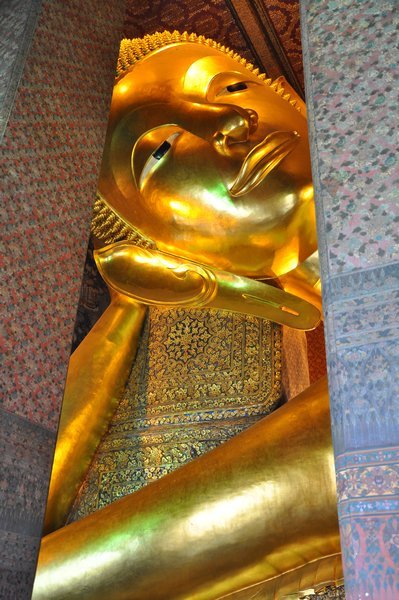 Wat Po, a huge 'reclining buddha' statue that fills an entire building