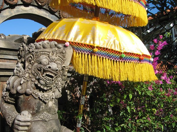 13 Balinese style sculptures and umbrellas
