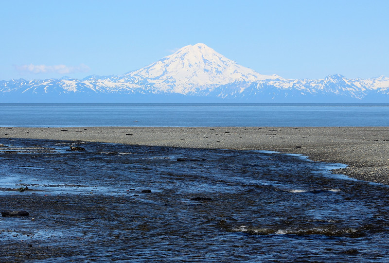 The Ninilchik River flowing toward Cook Inlet and the Redoubt Valcano