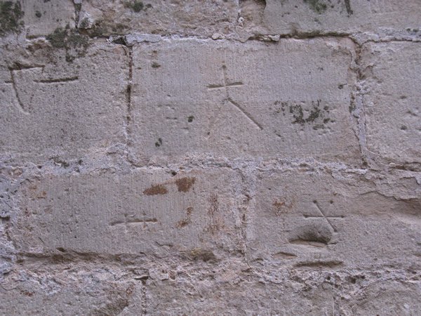 Stone mason mark in church wall