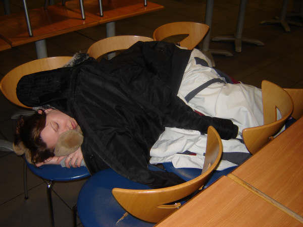 Me Sleeping in the Airport on my 6 Chairs