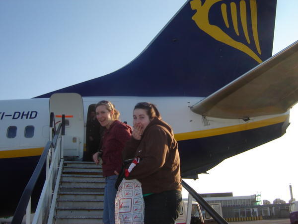 Dana and Paige on plane stairs