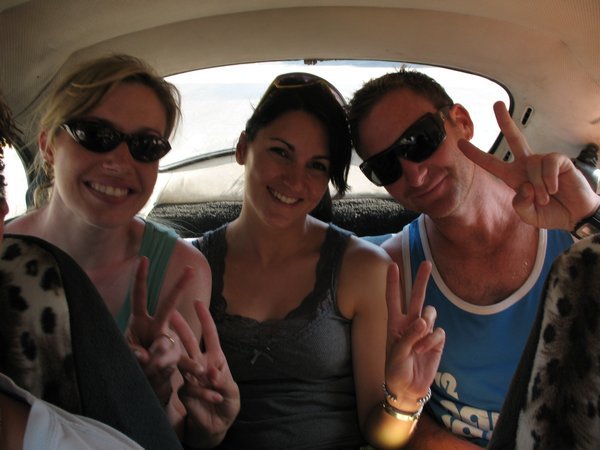 Erin crammed in the back of a cab in Lima, with Amy and John