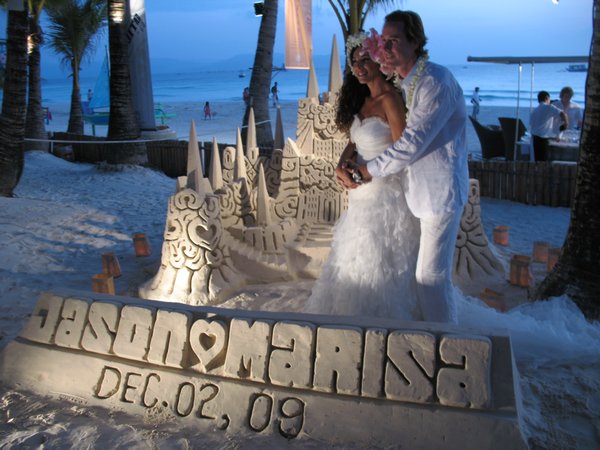 Jason & Marisa next to the amazing sand castle