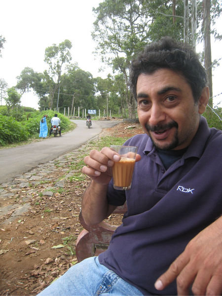 Enjoying a glass of chai on a chilly afternoon.