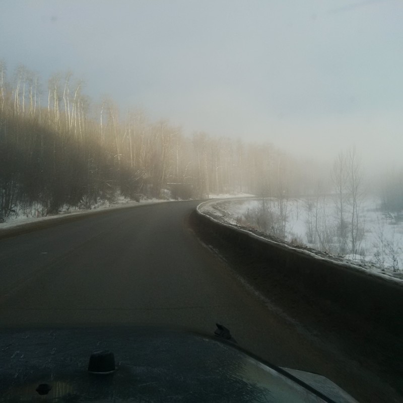 Fog rolls in from the Peace River