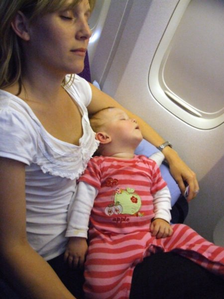 Caroline and Olivia asleep on plane to SA