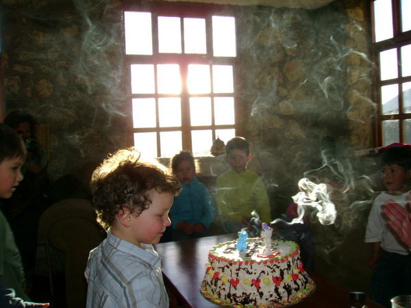 Tristan blowing out the candles on his cake