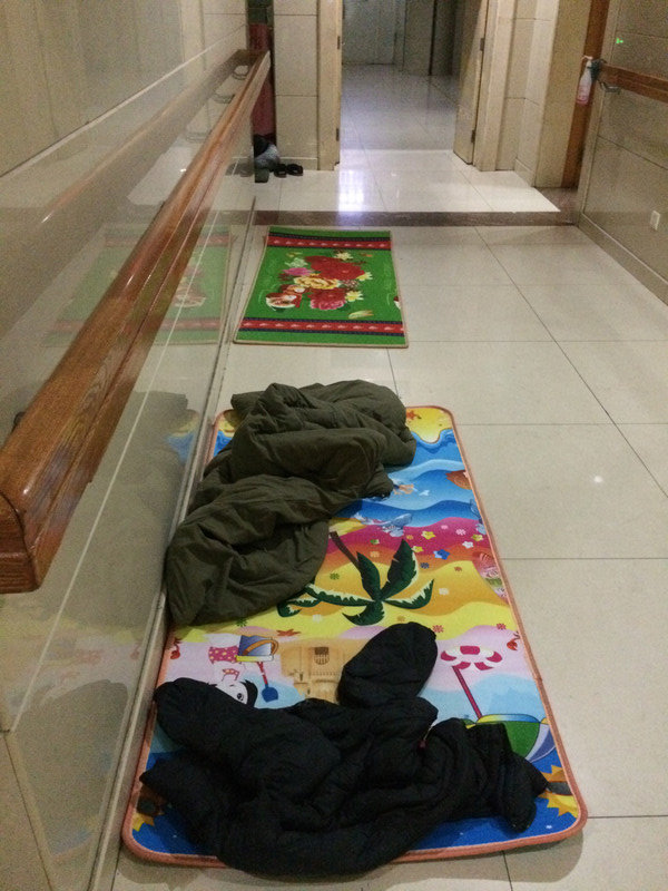Sleeping family members in the hallway