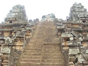 Climbing the ziggurat of Ta Keo