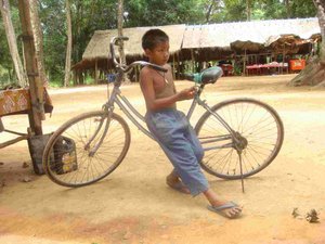 Boy with his bike - Prasat Thom