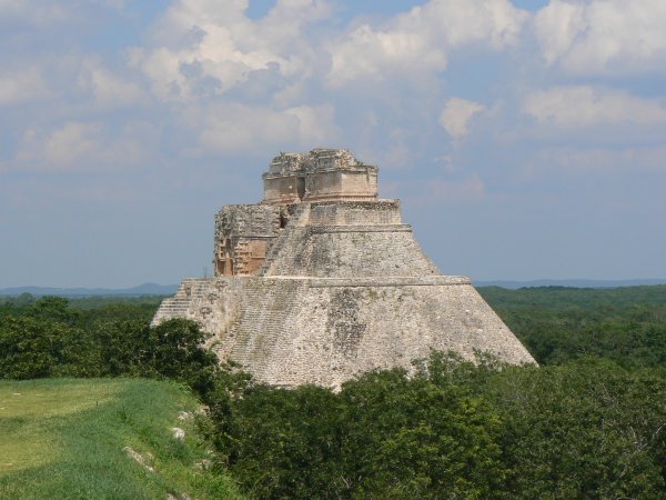 Uxmal.  From by the Governors Palace, looking towards the Magicians Pyramid and across the jungle