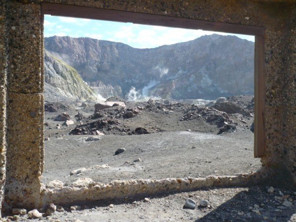 Looking through a window in the old mining works towards the vent and lake