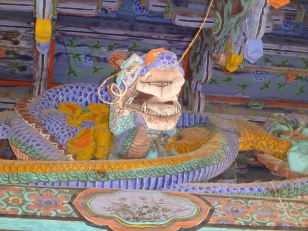Dragon on a fabulously decorated gate in the park