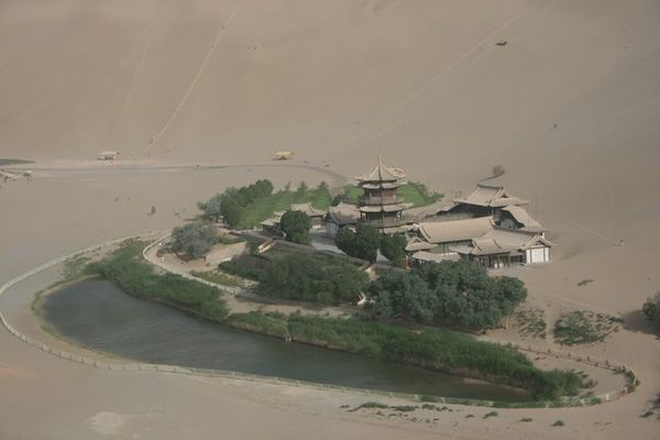 Crescent Moon Lake and temple - view from the top of the sand dunes