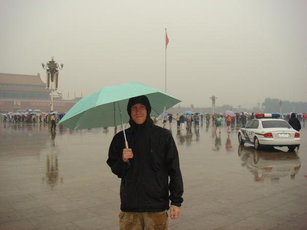 Jay in a rainy Tian'anmen Square
