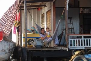 Locals on floating village, Chau Doc