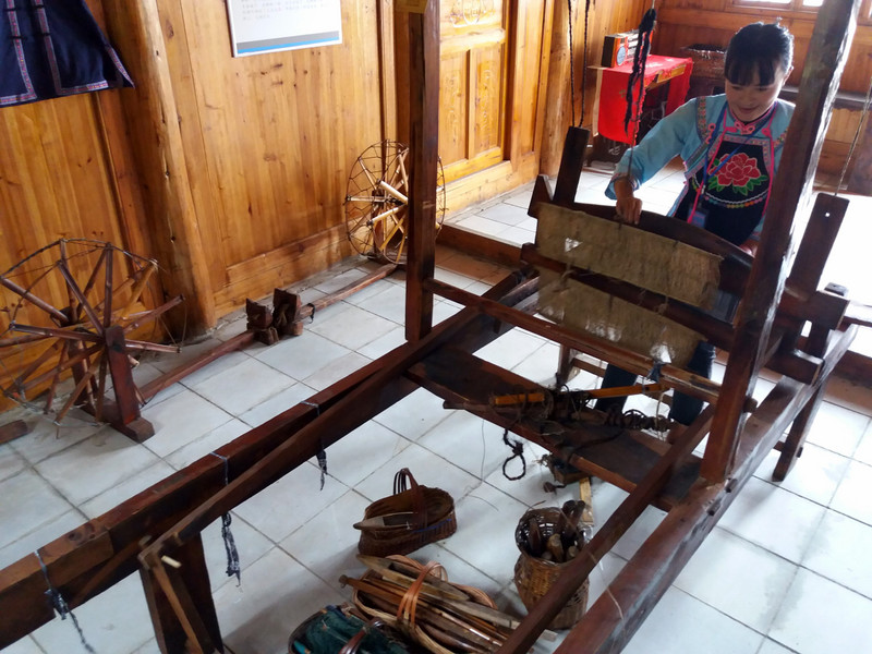 Local girl showing me how they used the old wooden waving machine